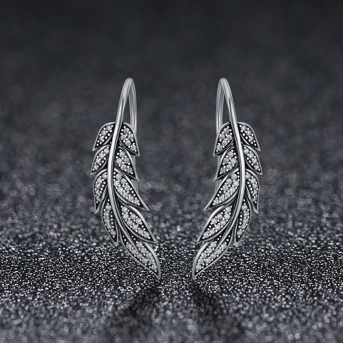 Aretes Brillo y Plumas - Plata .925