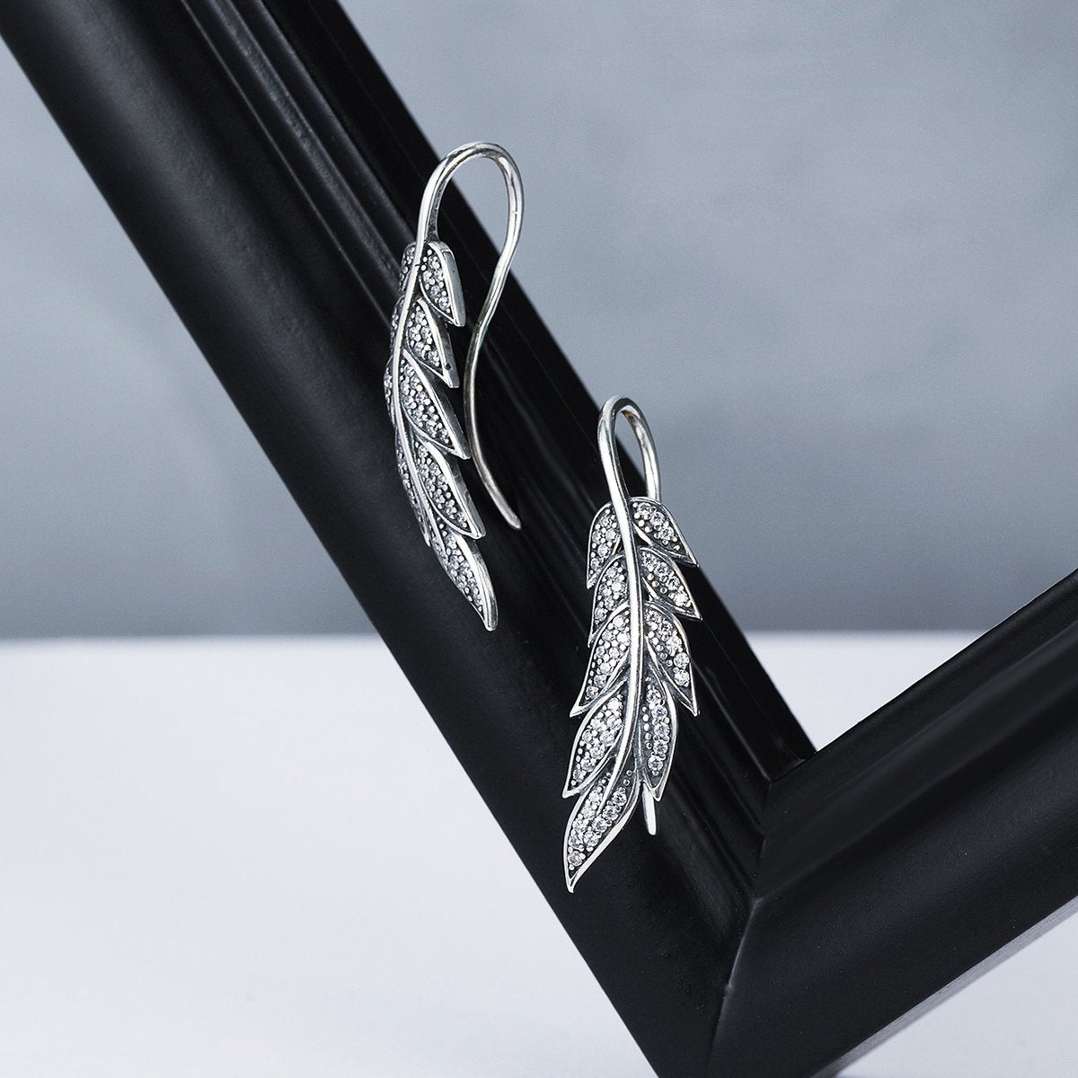 Aretes Brillo y Plumas - Plata .925