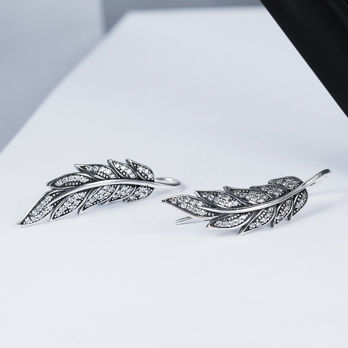 Aretes Brillo y Plumas - Plata .925
